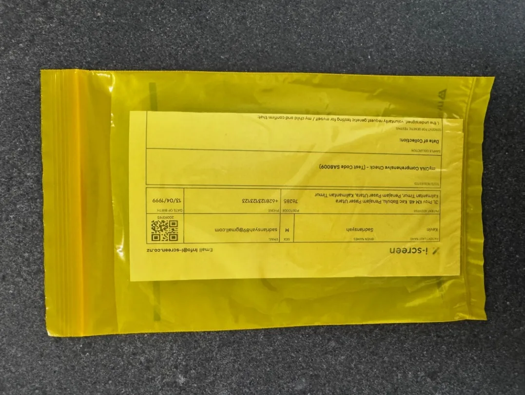 Inserting the request form into the outside pocket of the biohazard bag