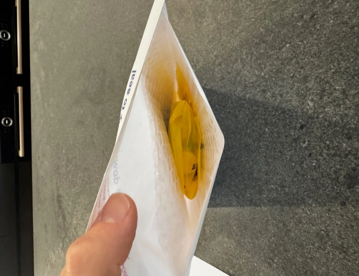 Placing the biohazard bag into the return mailer